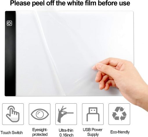A hand removing a protective film from an LED Tracing Board Light Box, suitable for 5D Diamond Painting, Crafts, Engineering or Kids. The board includes features such as a touch switch, eyesight protection, ultra-thin design (0.16 inch), USB power supply, and eco-friendly materials. Text at the top advises users to peel off the white film before use.